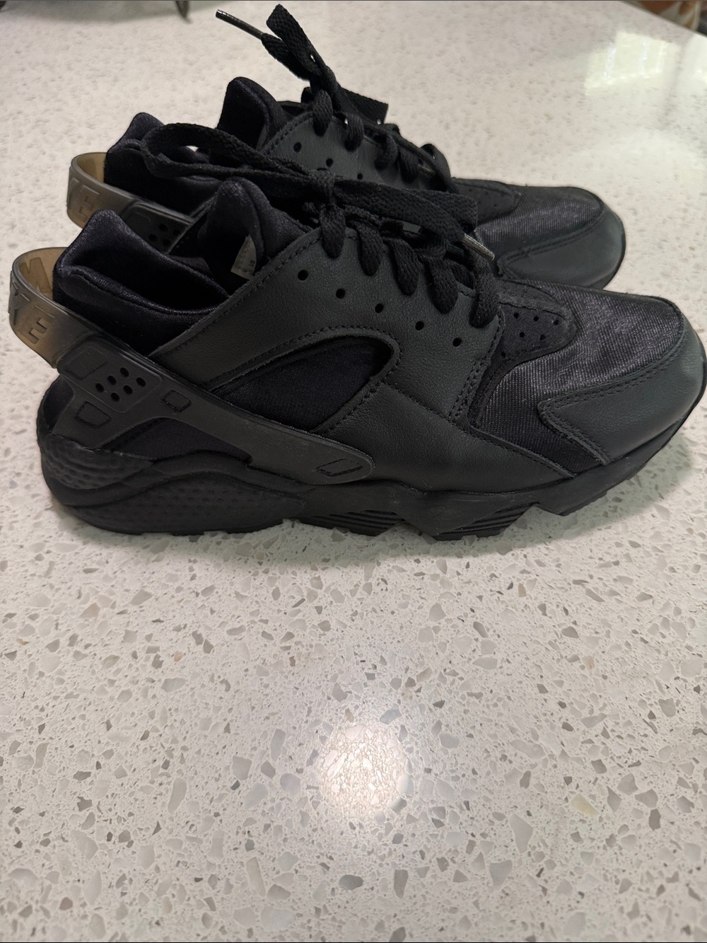 Women’s black Nike Huarache’s